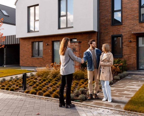 View Of A Couple Talking With Landlord